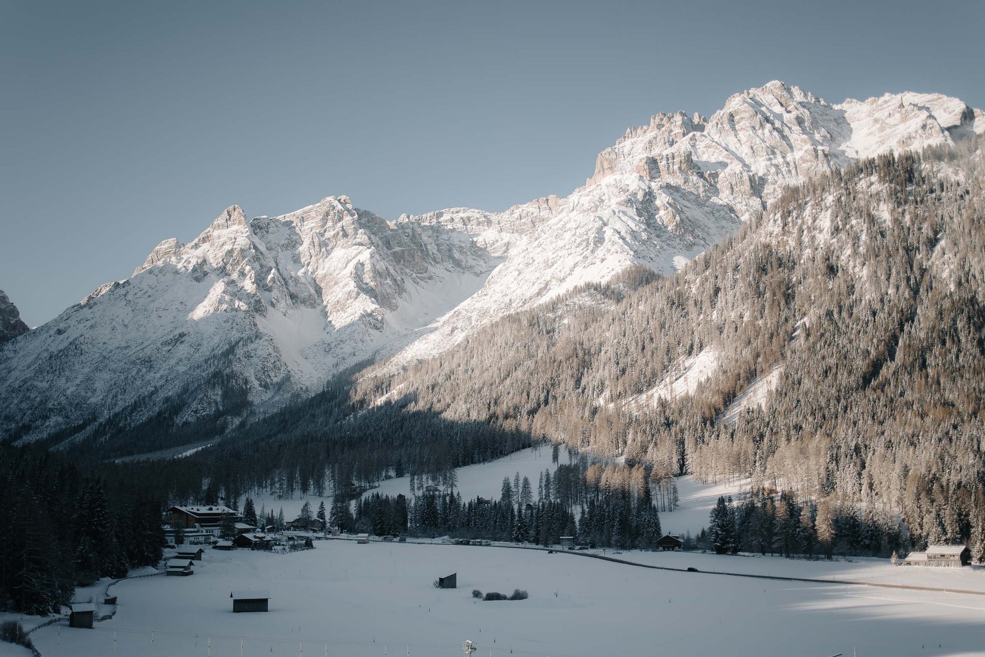 Live from Family Resort Rainer Snow-covered mountains and valley with houses under clear sky